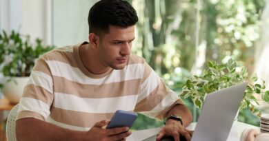 Man Answering E-mails on Laptop